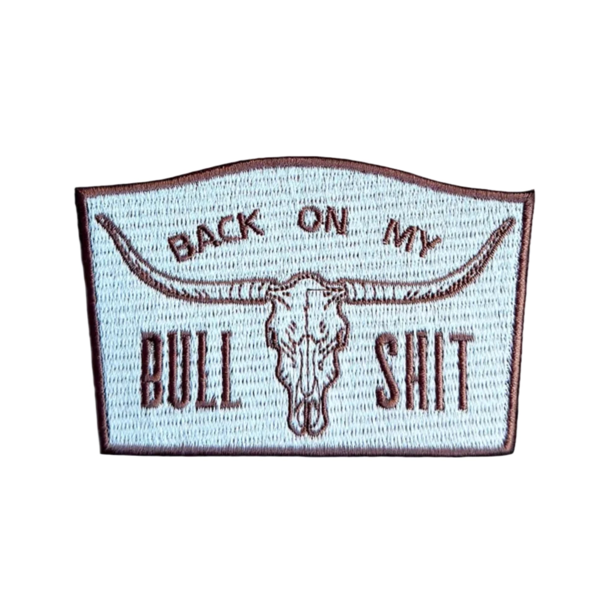 Embroidered patch with bull skull design and text on a white background
