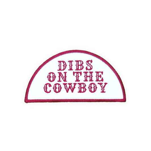 Dibs On The Cowboy embroidered iron-on patch on a white background