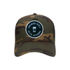 Drinks Well With Others trucker hat in camouflage, front view