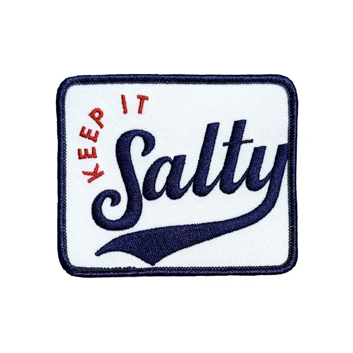 Keep It Salty embroidered iron-on patch with a navy border and vintage ballpark script lettering on a plain white background