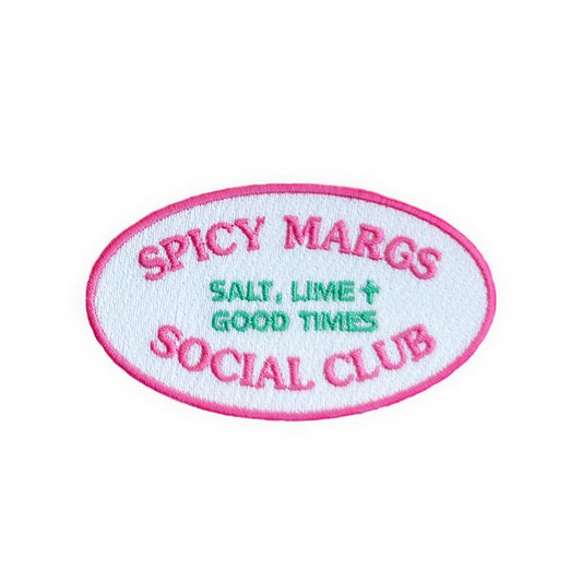 Spicy Margs Social Club embroidered iron-on patch, oval in white and mint with a hot pink border, on a white background
