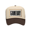 Gameday embroidered patch on a tan and brown high-profile foam trucker hat