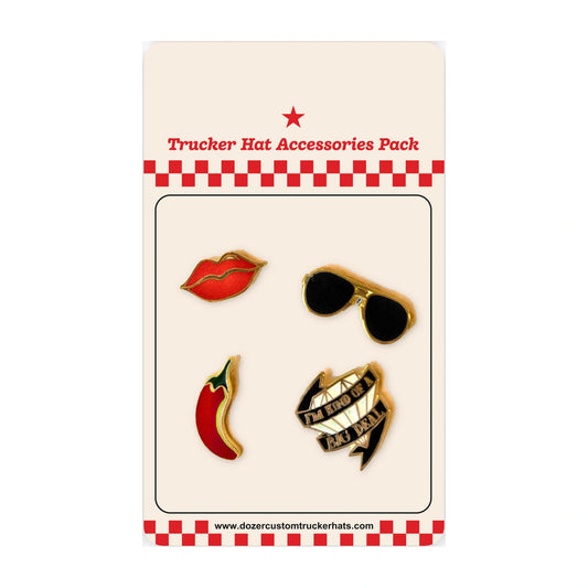 Main Character trucker hat accessories 4-pack: red lips, chili pepper, gold aviator sunglasses, and I'm Kind of a Big Deal enamel pins on a Dozer Custom Trucker Hats backing card