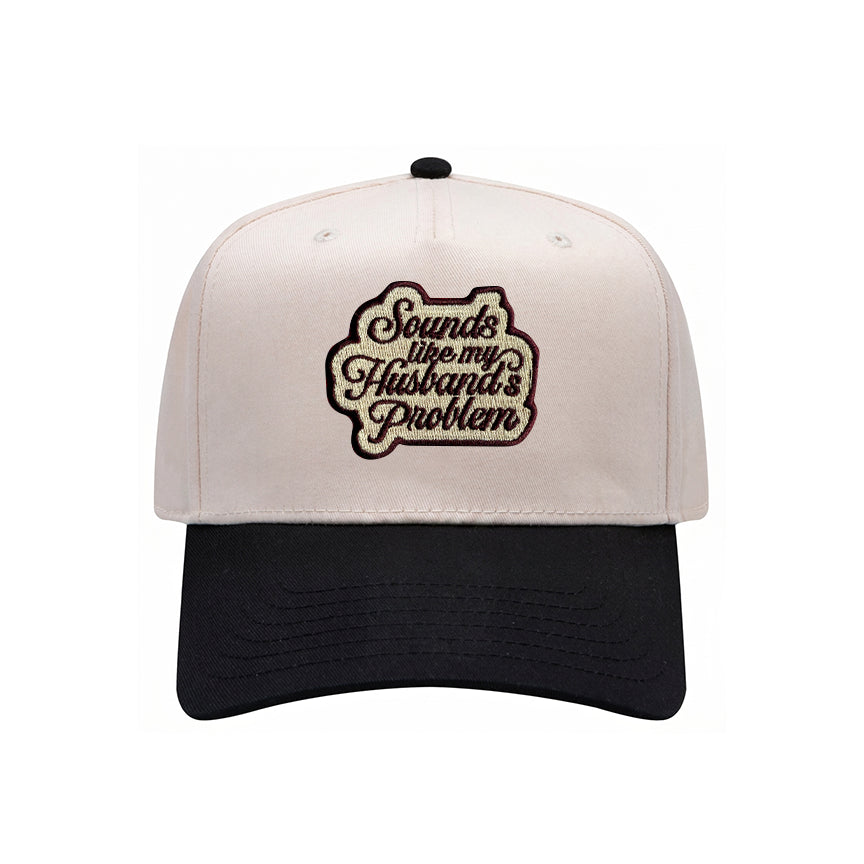 Sounds Like My Husband's Problem trucker hat in black with natural mesh, front view