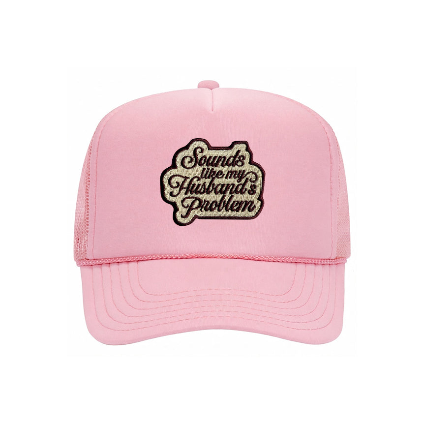 Sounds Like My Husband's Problem trucker hat in soft pink, front view