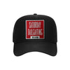 Saturday Tailgating Club embroidered patch on a black high-profile foam trucker hat