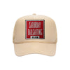 Saturday Tailgating Club embroidered patch on a tan high-profile foam trucker hat