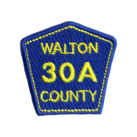 Walton County 30A embroidered iron-on patch, a small blue county road sign with yellow lettering and a yellow stitched border on a plain white background