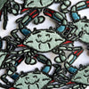 Embroidered crab patches on a white background