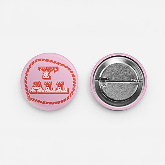 Y'ALL pin-back button with red western rope lettering on a pink background
