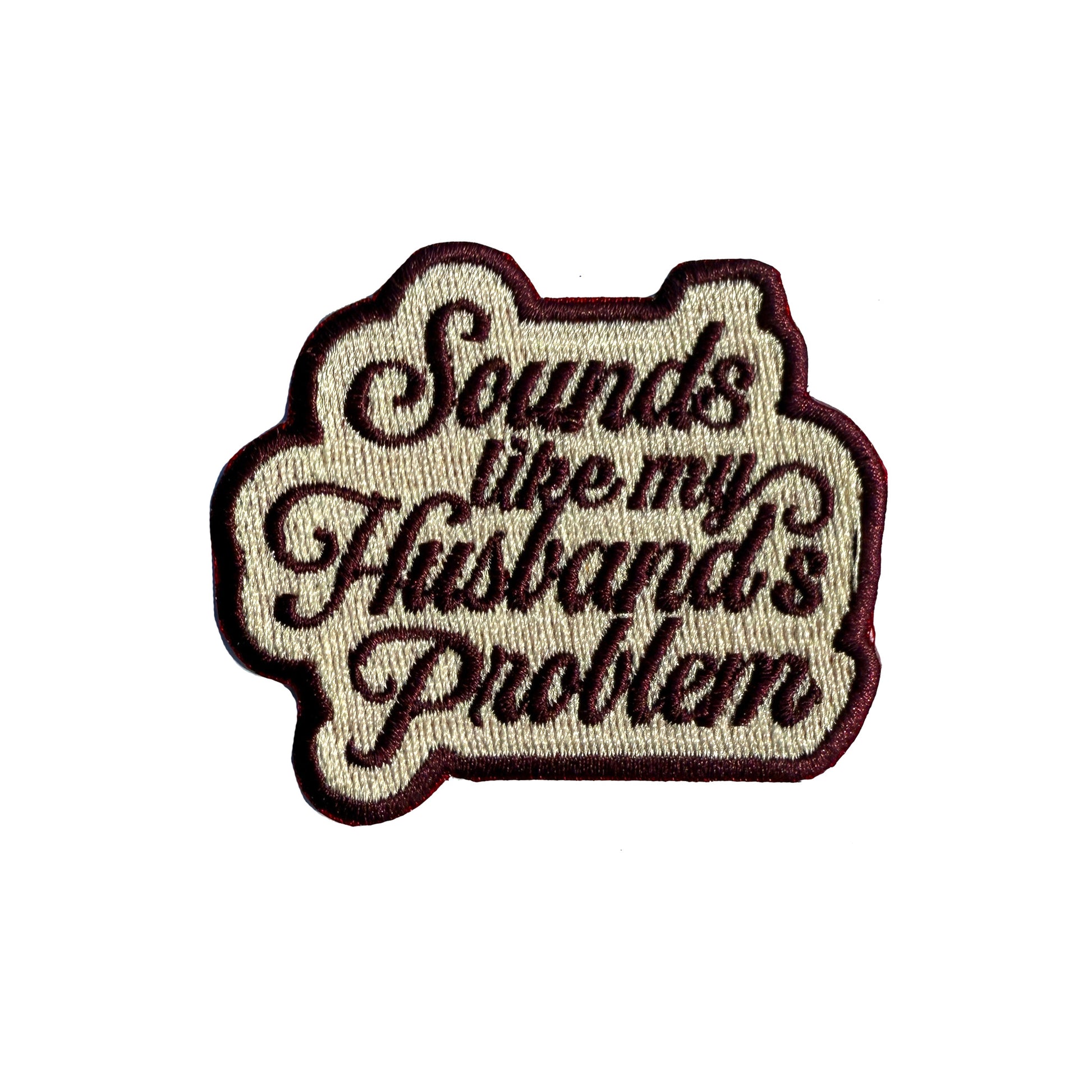 Sounds Like My Husband's Problem embroidered iron-on patch in maroon script on cream